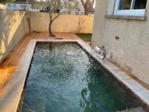 Piscine béton 6,5x2,5m volet immergé sous plage à Narbonne