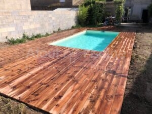 Piscine béton 6x3m avec plage en pin à Lézignan