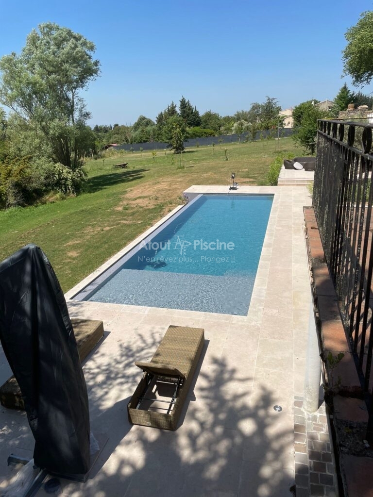 Piscine béton à débordement 15x4m à Villemagne