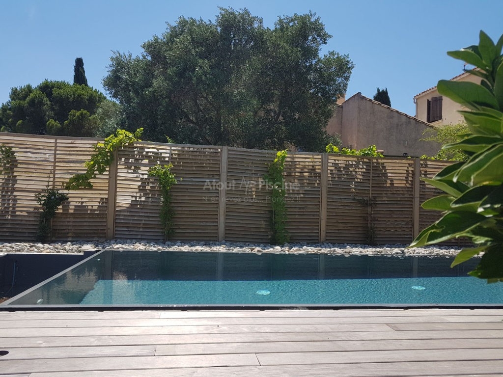 Piscine miroir 8x3m avec volet sous plage Narbonne